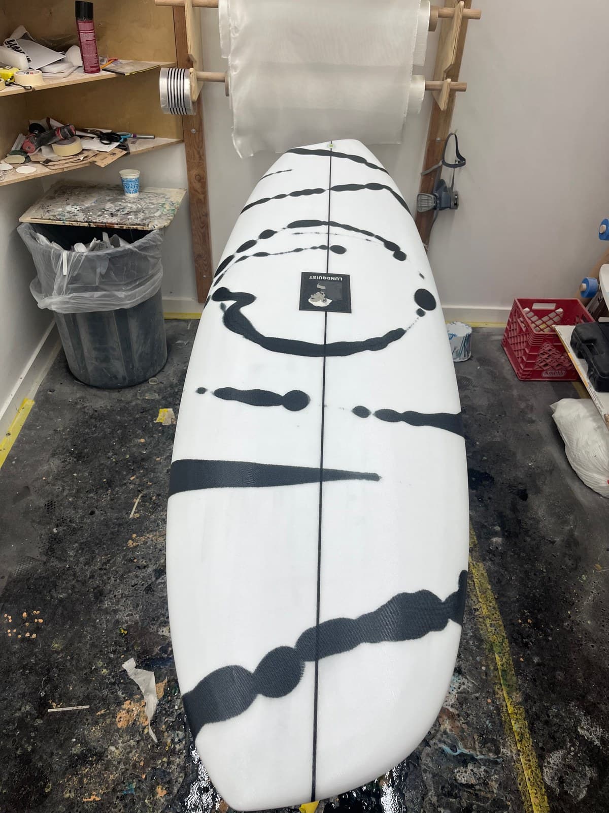 Gumball shortboard with ink splatter and circle motif in workshop with swallow tail