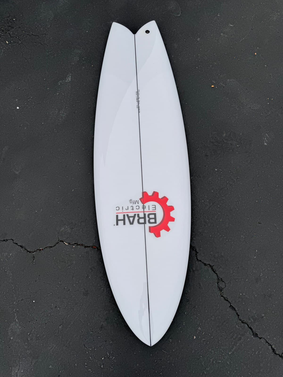 Suds clear sanded twin fin signage board with BRAH Electric logo, alternate angle